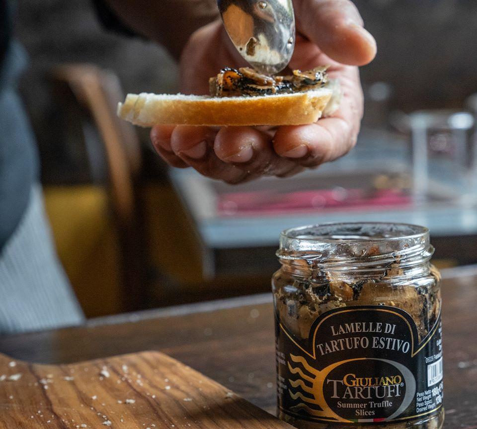 black truffle slices on bread